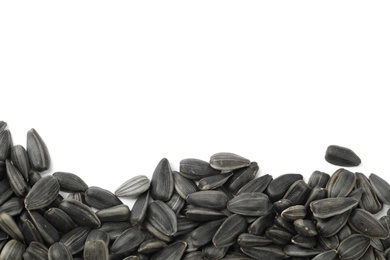 Raw sunflower seeds on white background, top view