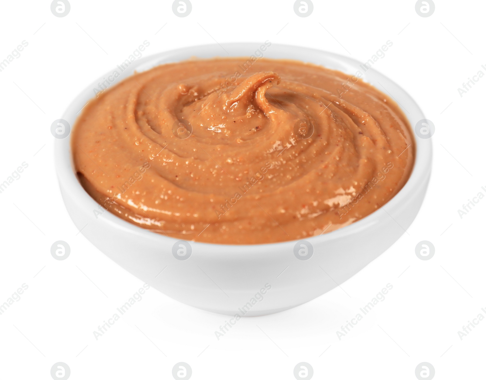 Photo of Delicious nut butter in bowl isolated on white