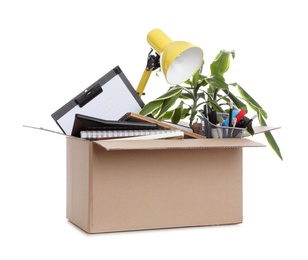 Photo of Cardboard box full of office stuff on white background