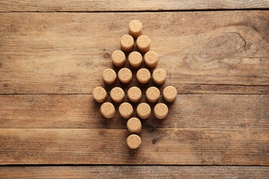 Christmas tree made of wine corks on wooden table, top view