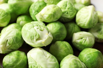 Photo of Pile of tasty fresh Brussels sprouts, closeup