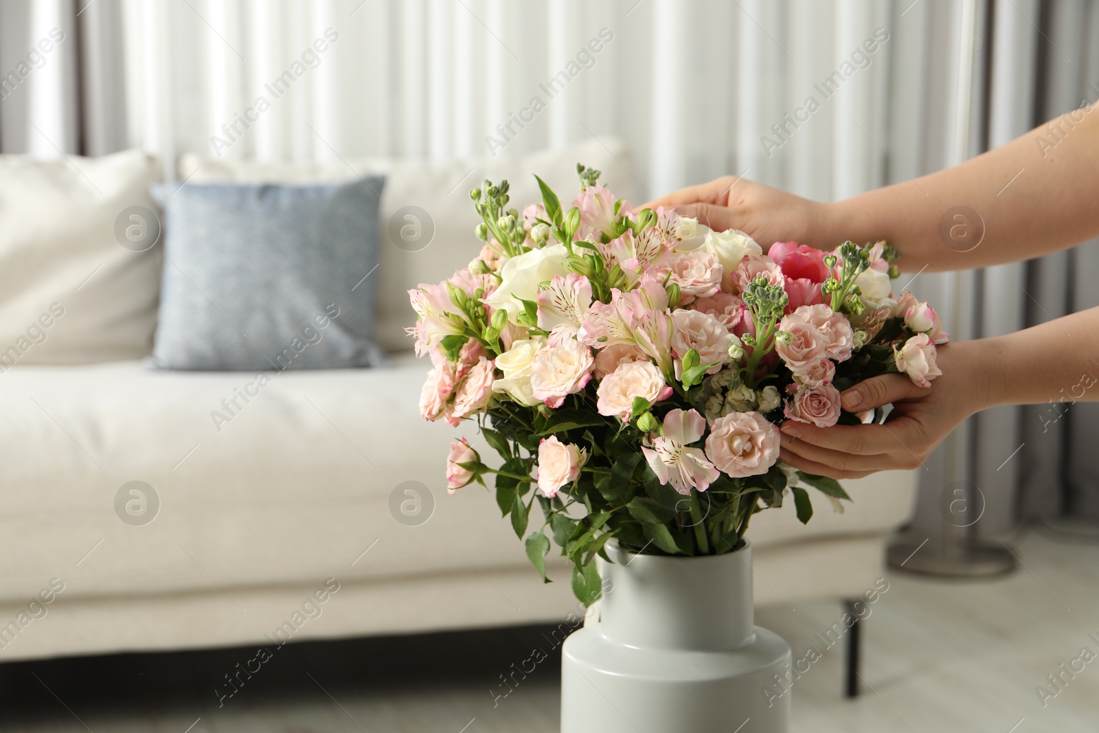 Photo of Woman with beautiful bouquet of fresh flowers at home, closeup. Space for text