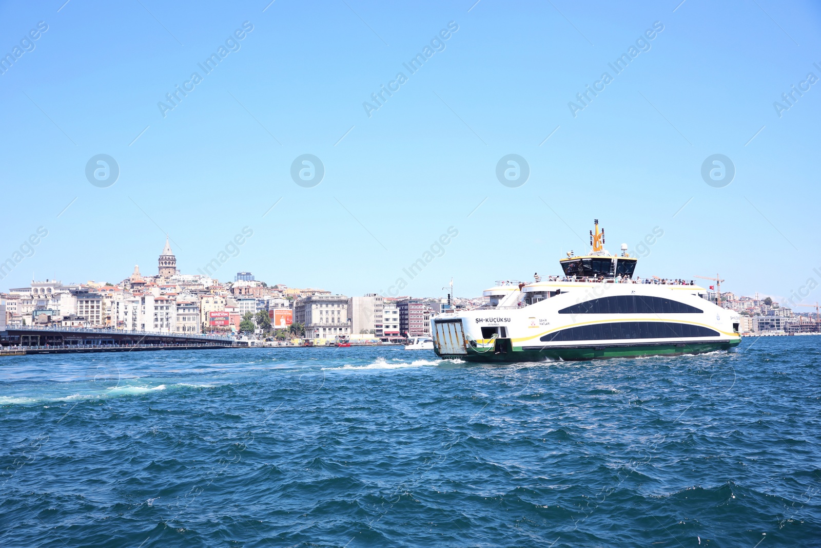 Photo of ISTANBUL, TURKEY - AUGUST 10, 2019: Bosphorus strait with maritime transport and city on sunny day