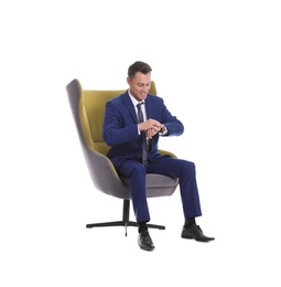 Photo of Young businessman sitting in comfortable armchair on white background