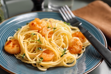 Photo of Delicious pasta with shrimps on plate