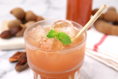 Freshly made tamarind juice with mint, closeup