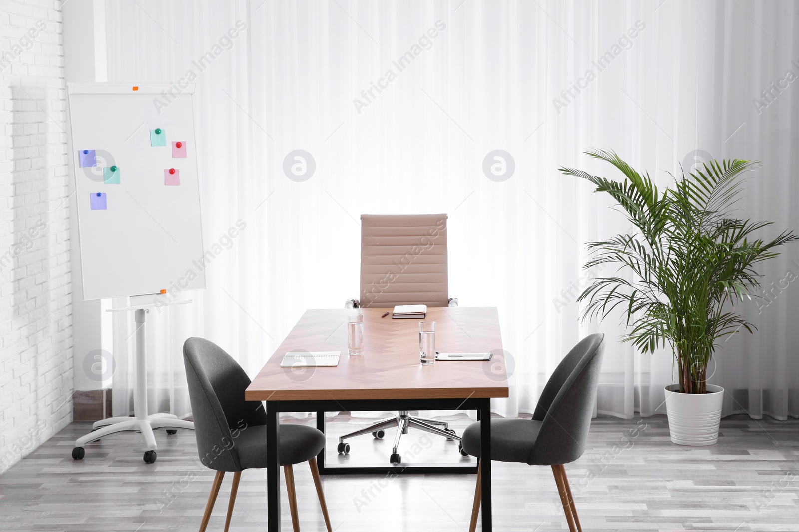 Photo of Interior of modern office with table and chairs