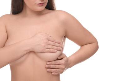 Photo of Mammology. Naked woman doing breast self-examination on white background, closeup