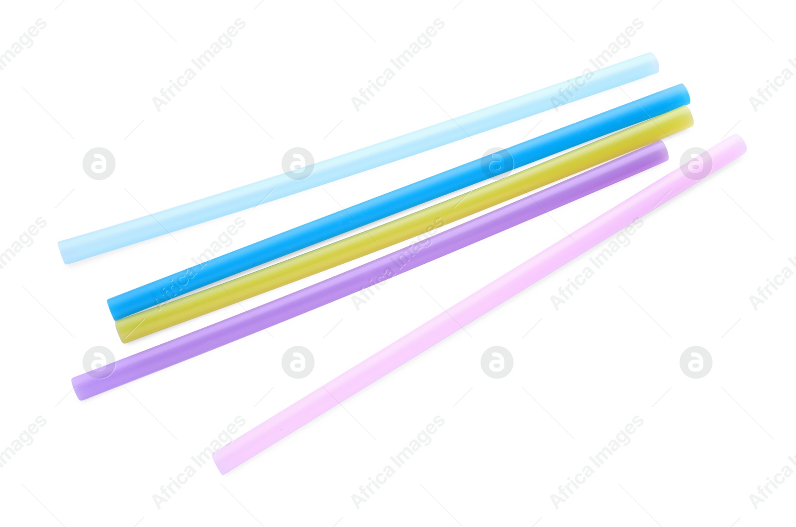 Photo of Color plastic cocktail tubes on white background