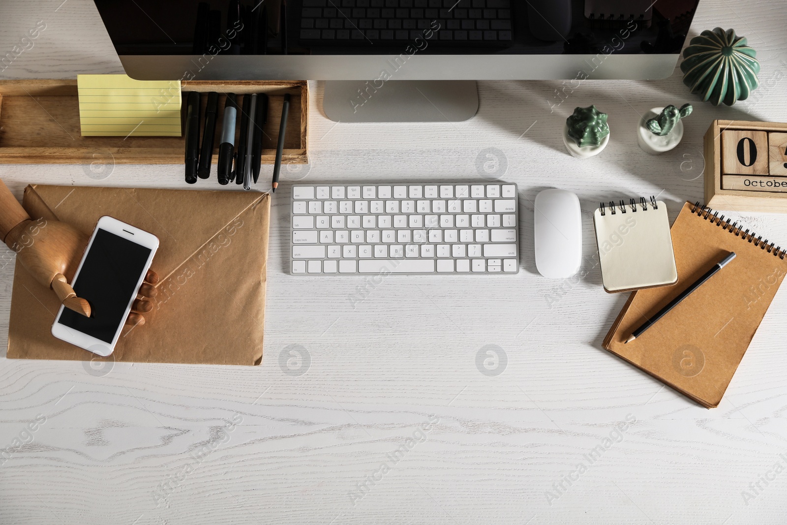 Photo of Designer's workplace with modern computer and stationery, flat lay. Space for text