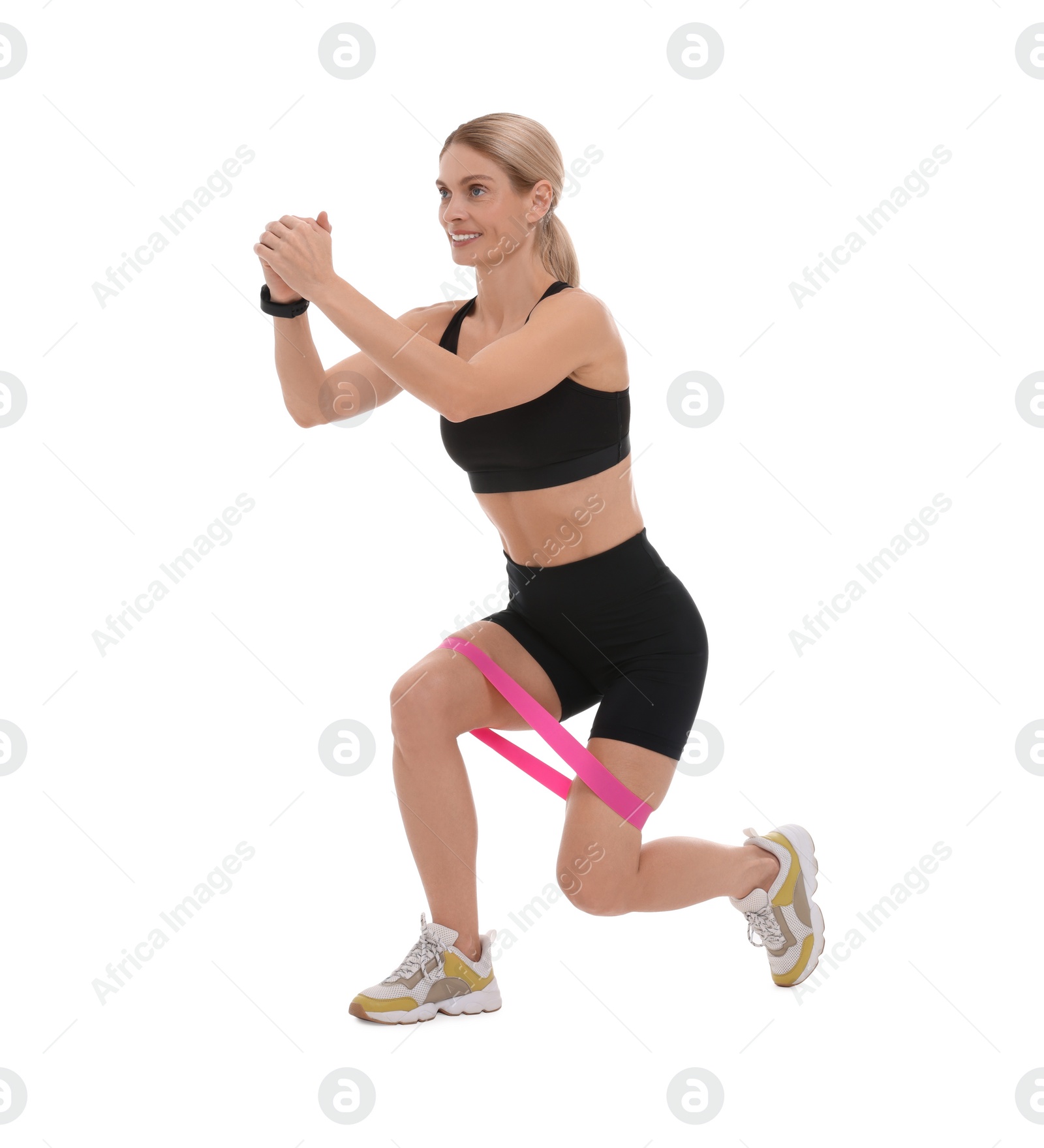 Photo of Woman exercising with elastic resistance band on white background