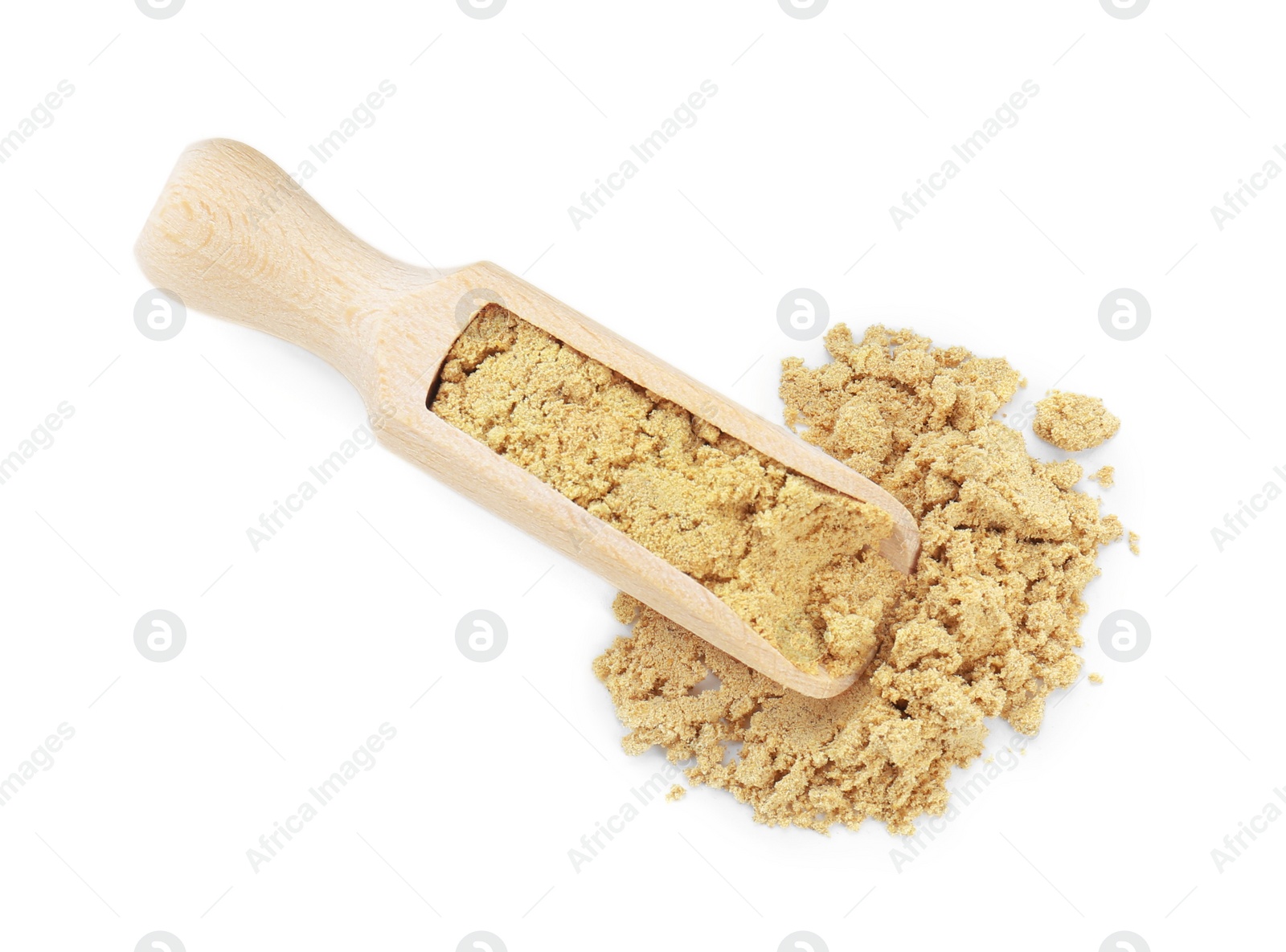 Photo of Wooden scoop with aromatic mustard powder on white background, top view