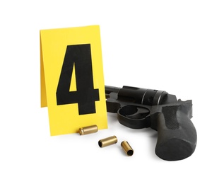 Gun, shell casings and crime scene marker with number four isolated on white