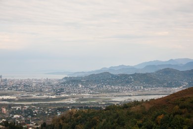 Photo of Picturesque view of beautiful valley, city and mountains