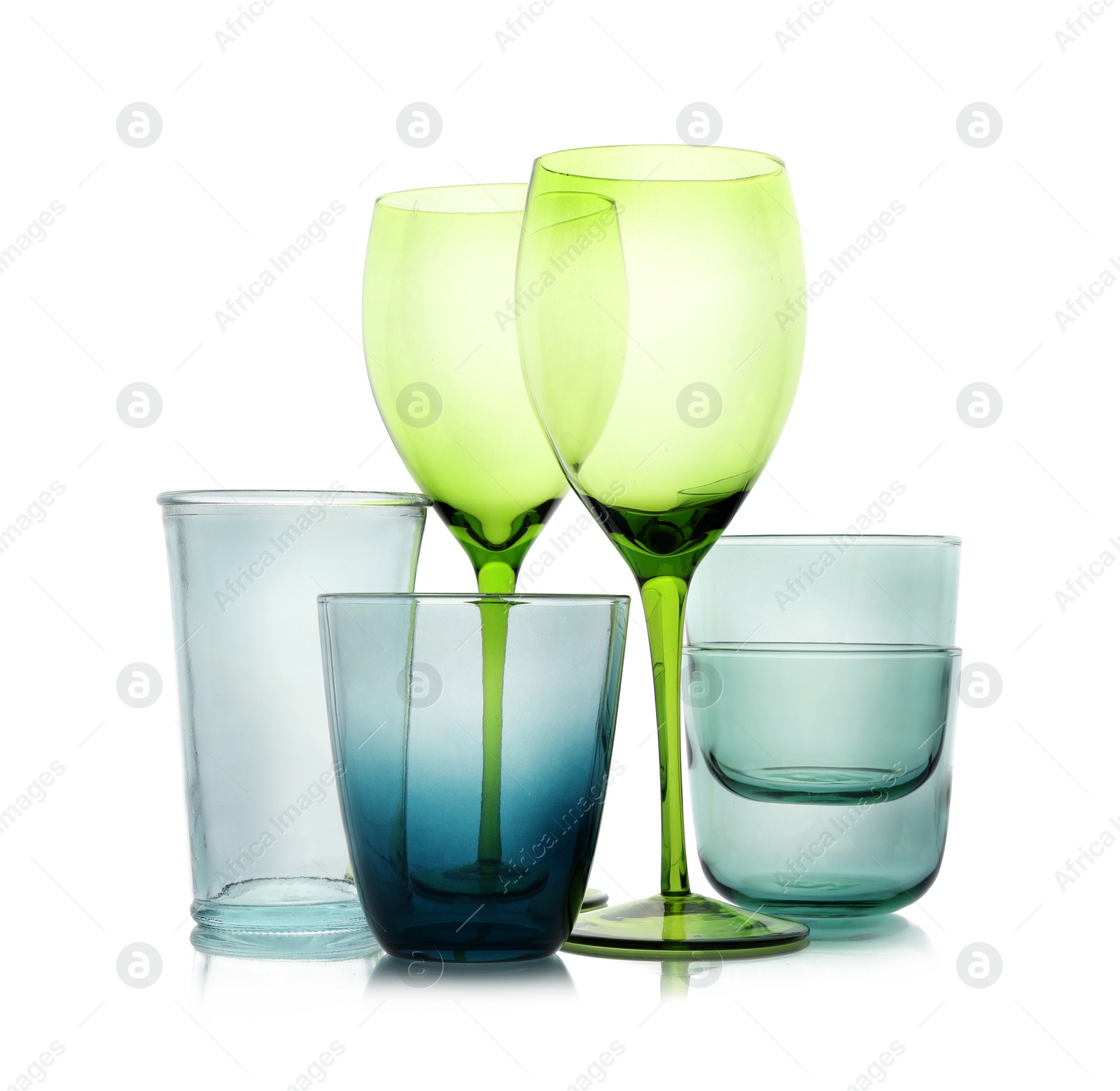 Photo of Set of colorful empty glasses on white background