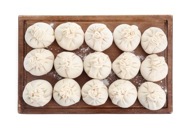 Photo of Board with uncooked khinkali (dumplings) isolated on white, top view. Georgian cuisine