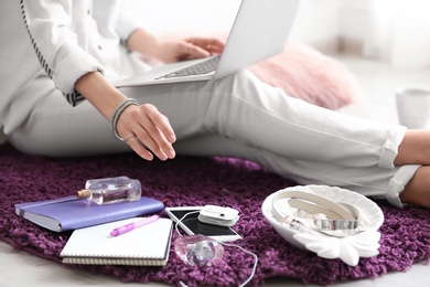 Female blogger with laptop indoors