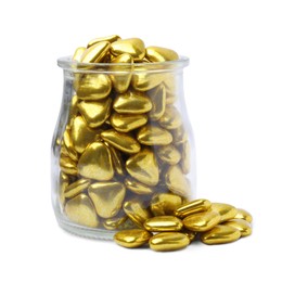 Glass jar and delicious heart shaped candies on white background