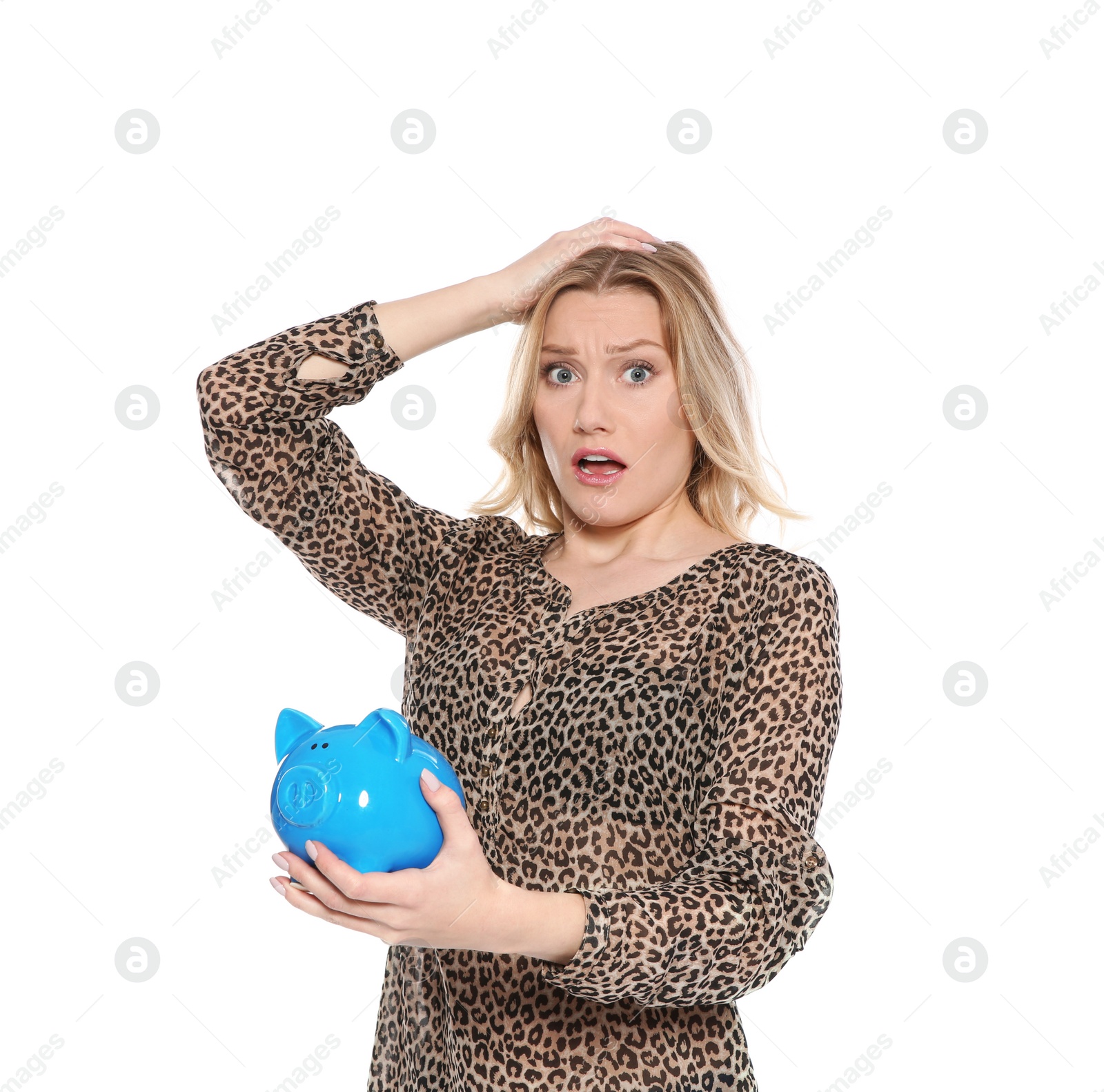 Photo of Emotional young woman with piggy bank on white background