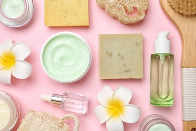 Photo of Flat lay composition with body care products on color background