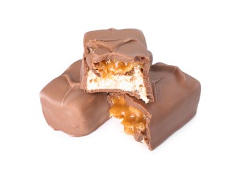 Photo of Pieces of tasty chocolate bars with nougat on white background