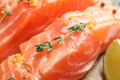 Photo of Fresh salmon with mustard and thyme, closeup