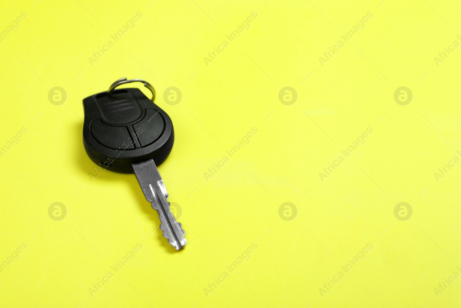 Photo of Car key on color background. Space for text