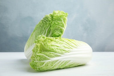 Photo of Fresh ripe cabbages on wooden table