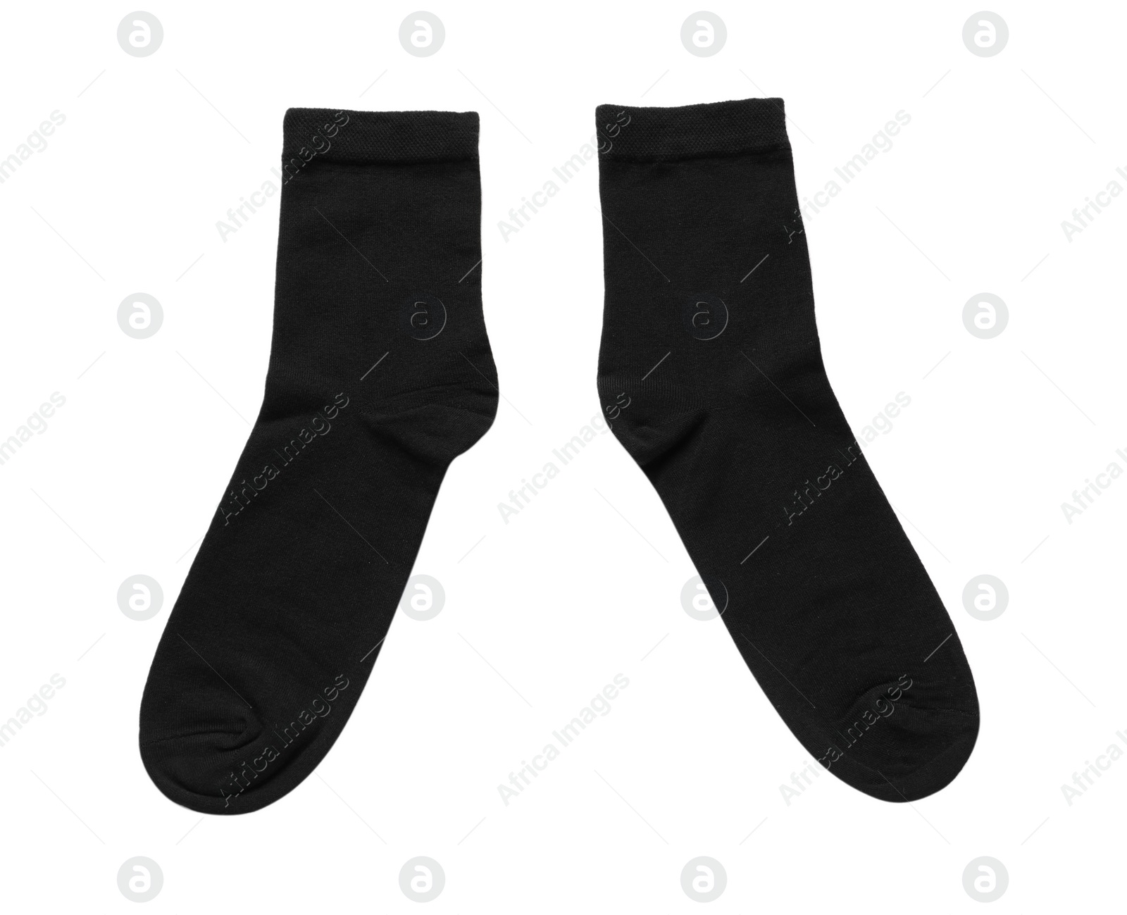 Photo of Pair of black socks isolated on white, top view