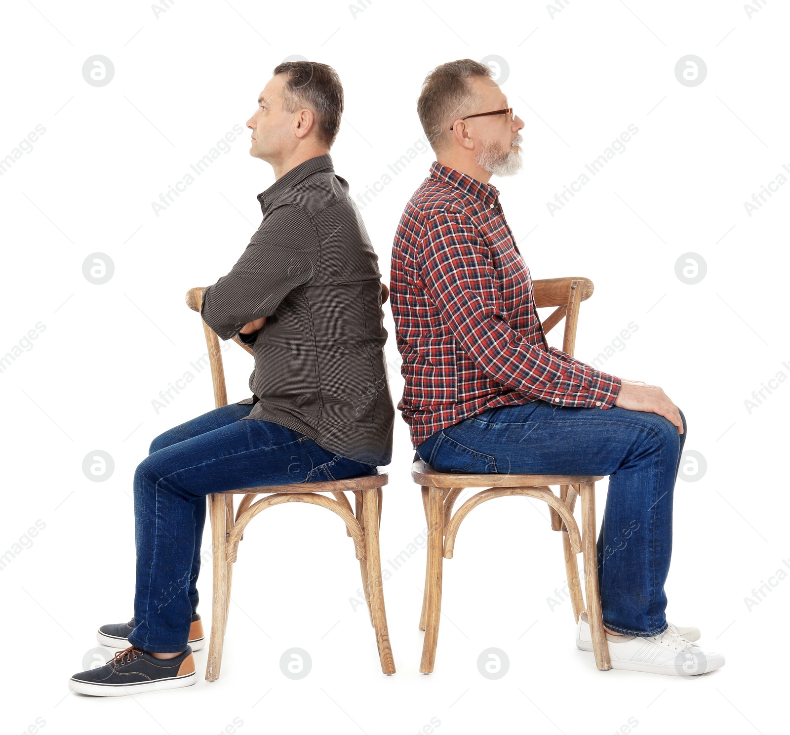 Photo of Senior men sitting on chairs against white background