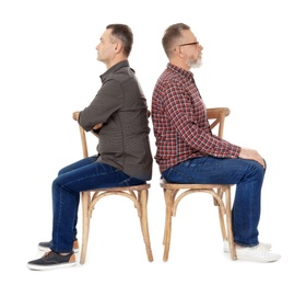 Photo of Senior men sitting on chairs against white background