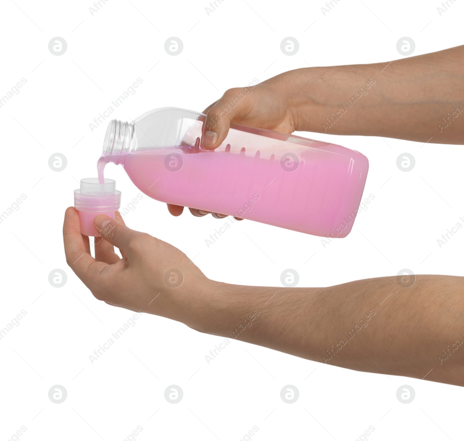 Man pouring fabric softener from bottle into cap for washing clothes on white background, closeup Photo of Man pouring fabric softener from bottle into cap for washing clothes on white background, closeup