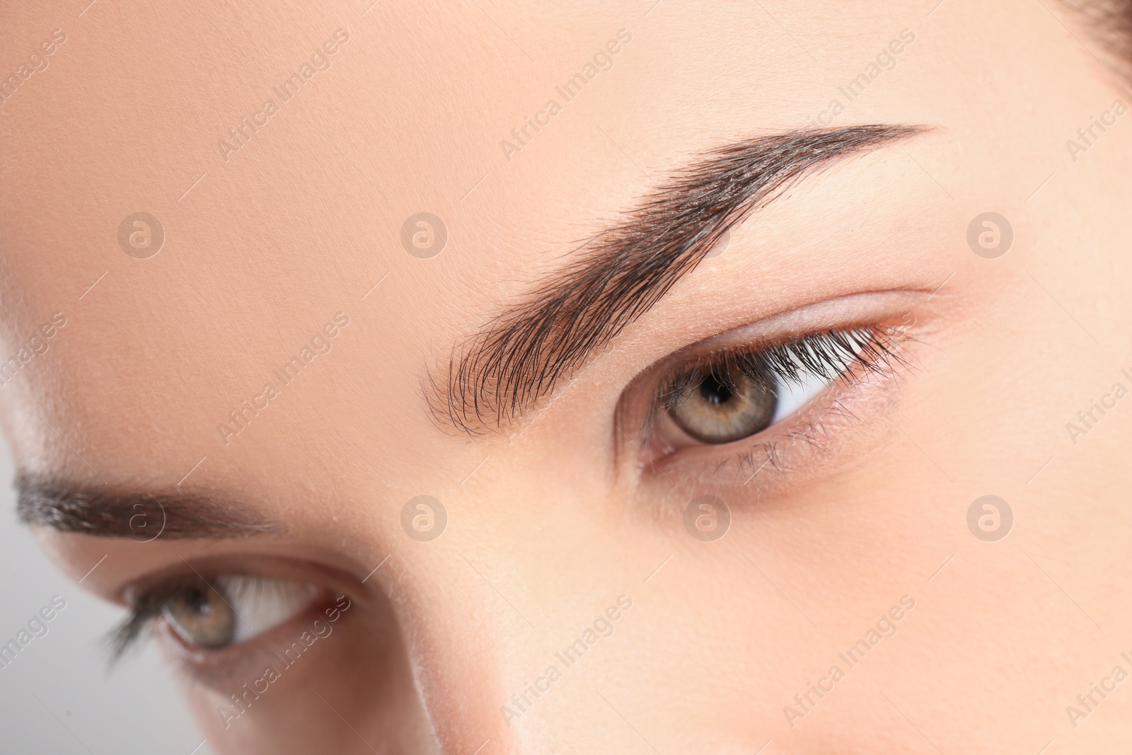 Photo of Beautiful woman with perfect eyebrows, closeup