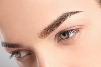 Beautiful woman with perfect eyebrows, closeup