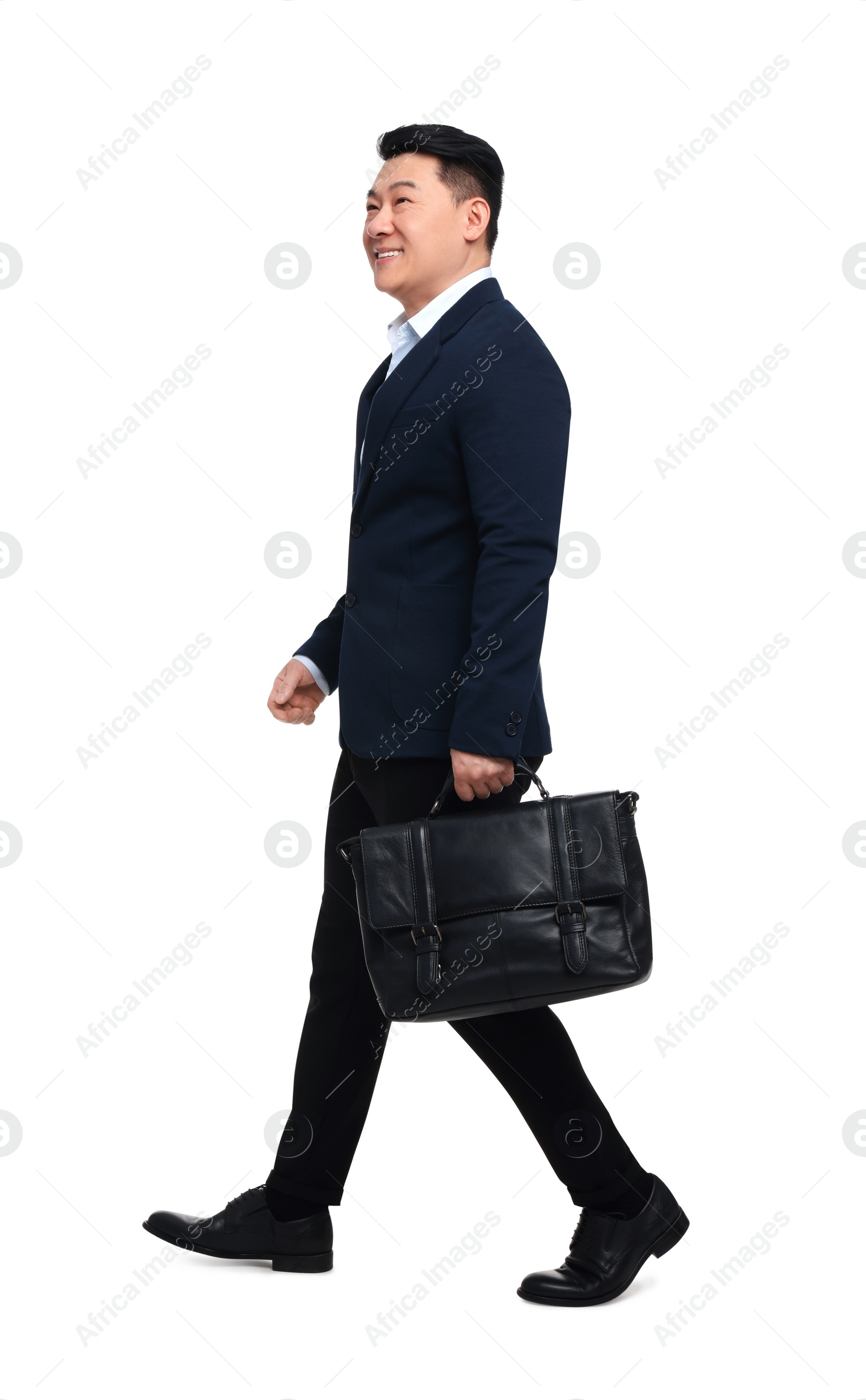 Photo of Businessman in suit with briefcase walking on white background