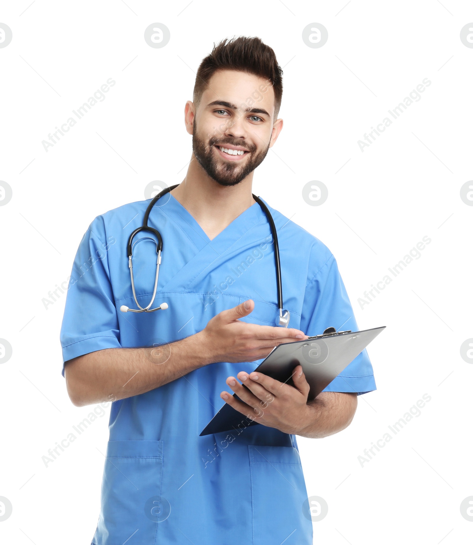 Photo of Young male doctor in uniform with clipboard isolated on white