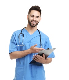 Young male doctor in uniform with clipboard isolated on white