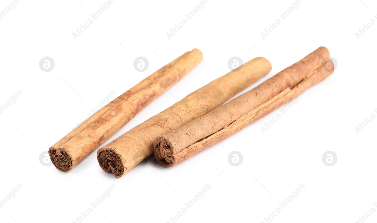 Photo of Three aromatic cinnamon sticks isolated on white