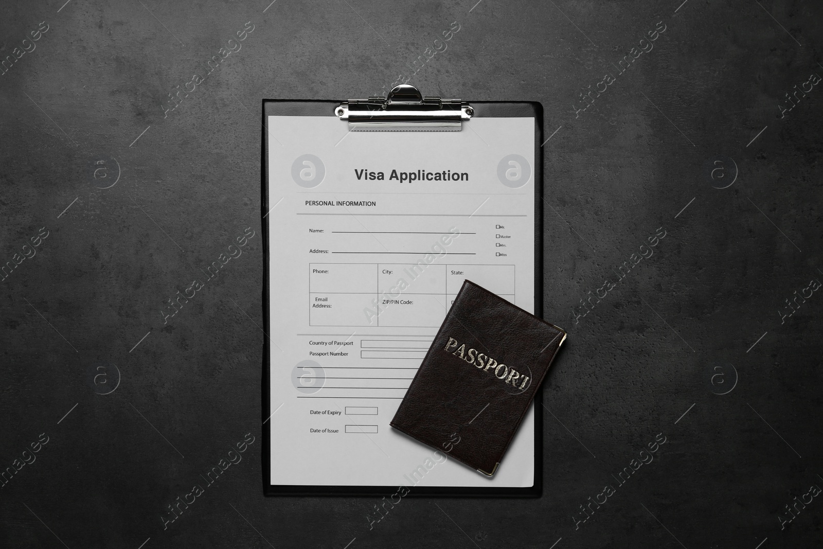 Photo of Visa application form for immigration and passport on grey table, top view