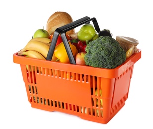 Photo of Shopping basket with grocery products on white background