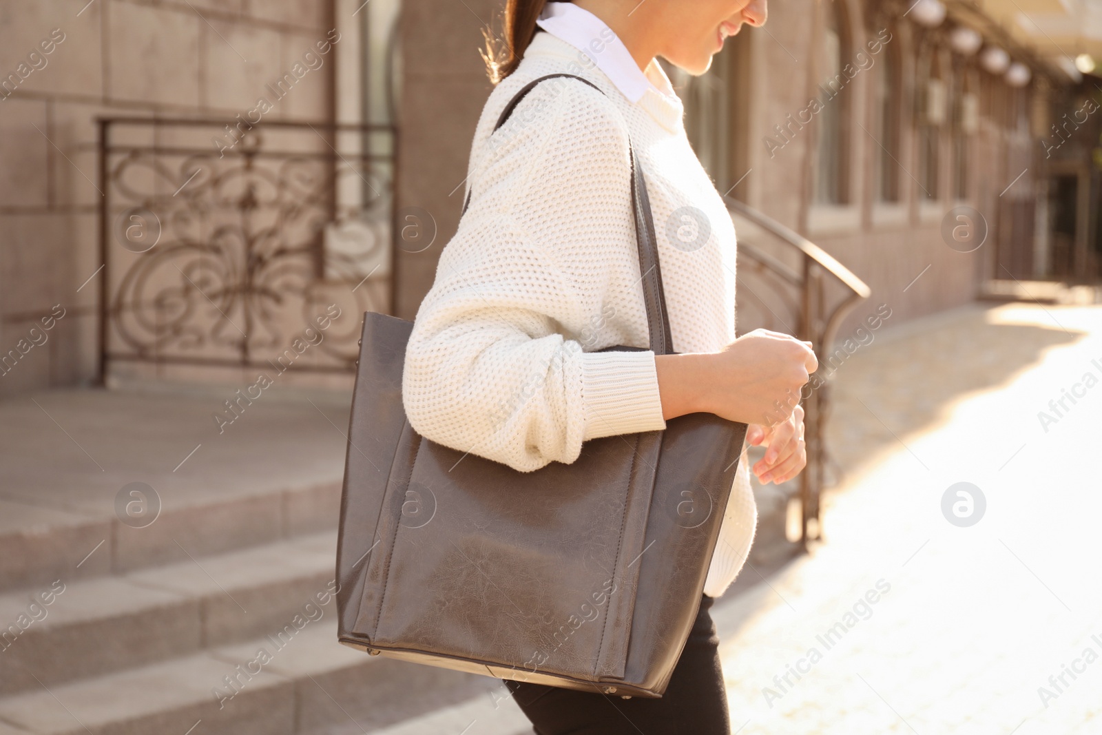 Photo of Woman with stylish shopper bag outdoors, closeup