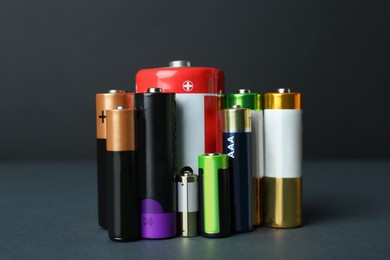 Image of Different types of batteries on dark background