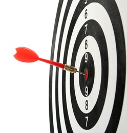 Photo of Red arrow hitting target on dart board against white background