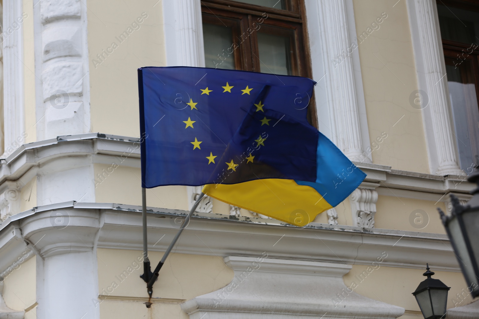 Photo of Flags of Ukraine and European Union on building facade