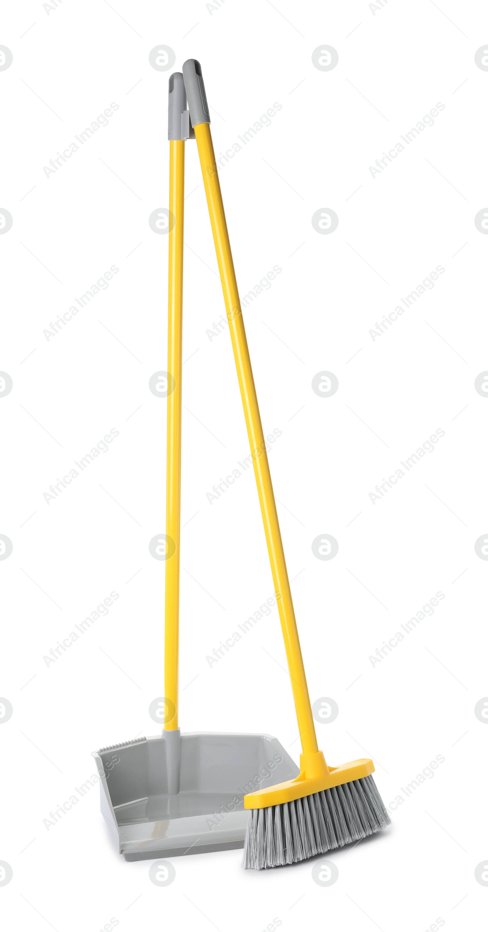 Photo of Plastic broom and dustpan on white background