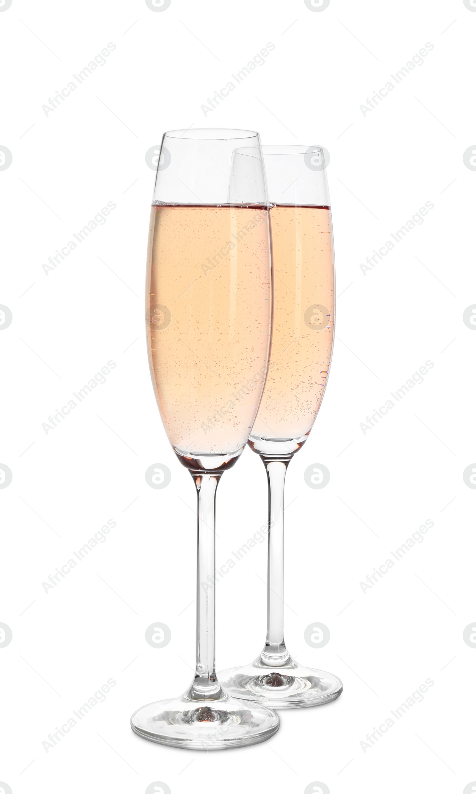 Photo of Glasses of sparkling rose champagne isolated on white