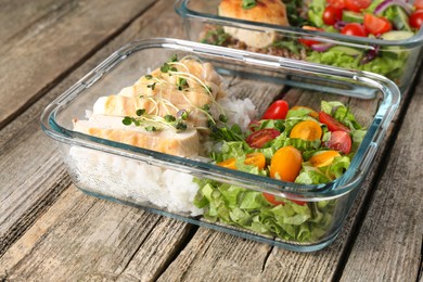 Healthy meal. Containers with different products on wooden table, closeup