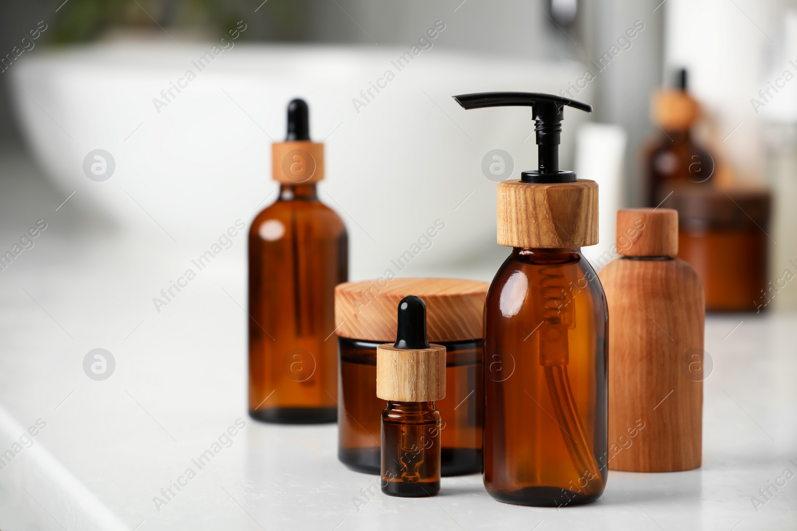 Photo of Different personal care products on countertop in bathroom, closeup. Space for text