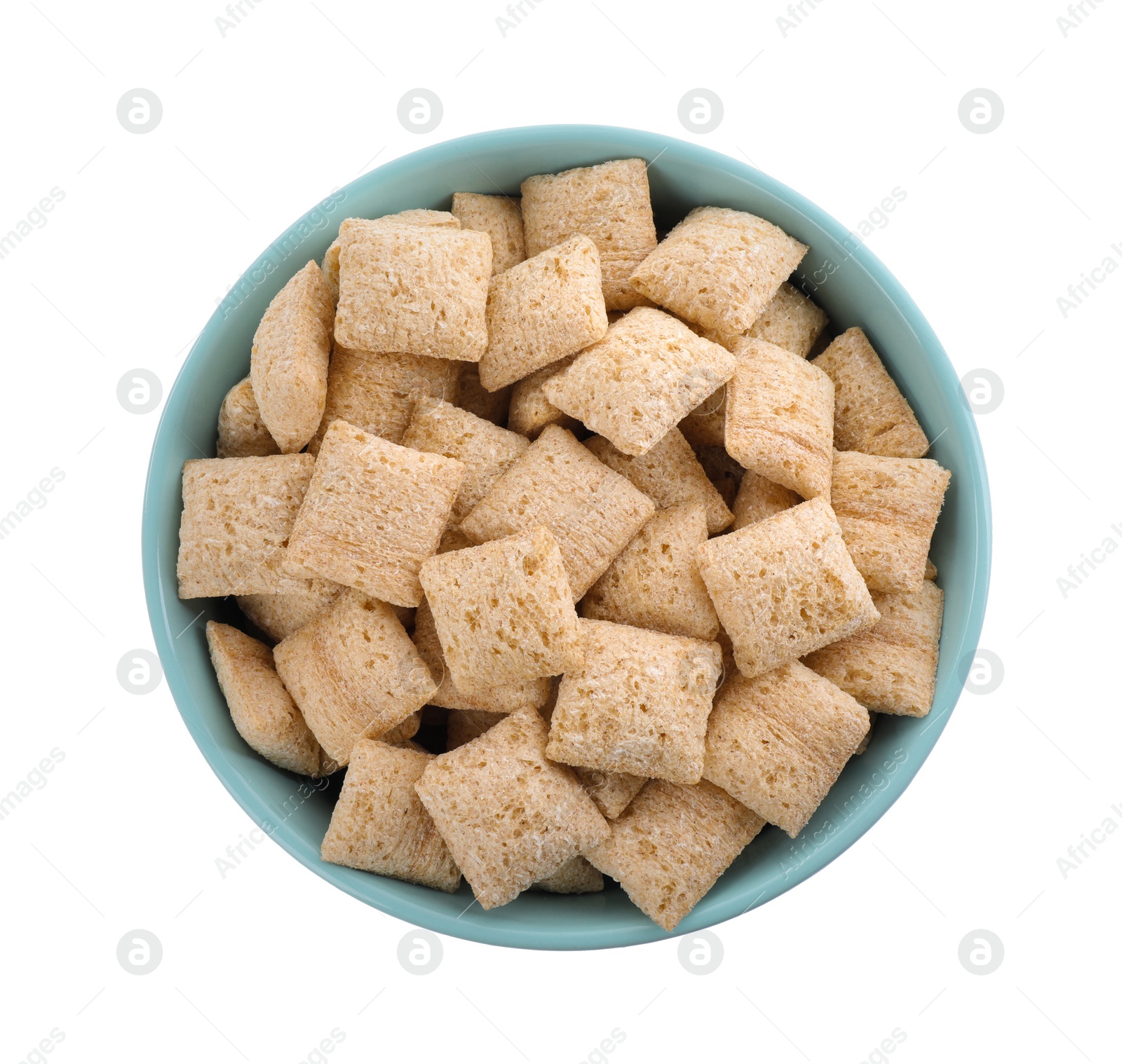 Photo of Bowl of delicious corn pads isolated on white, top view