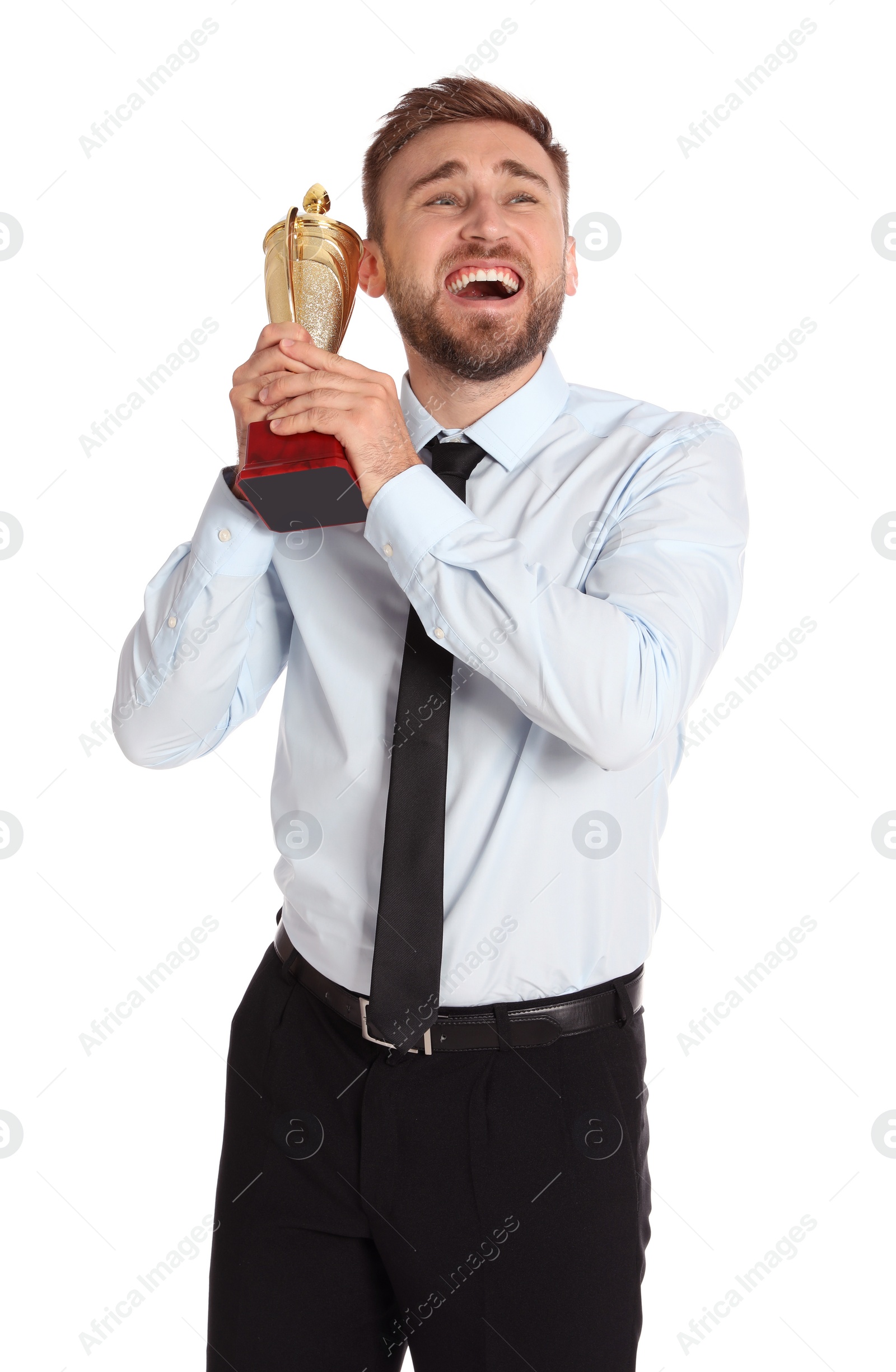 Photo of Portrait of happy young businessman with gold trophy cup on white background